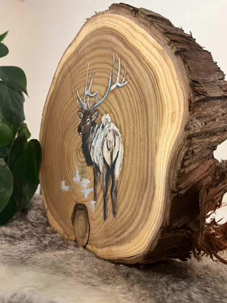 Elk on wood round