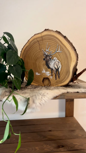 Elk on wood round