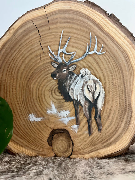 Elk on wood round